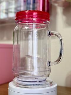 20 oz Clear Acrylic Mason Jar Tumbler (Snow Globe) with a Pink lid.